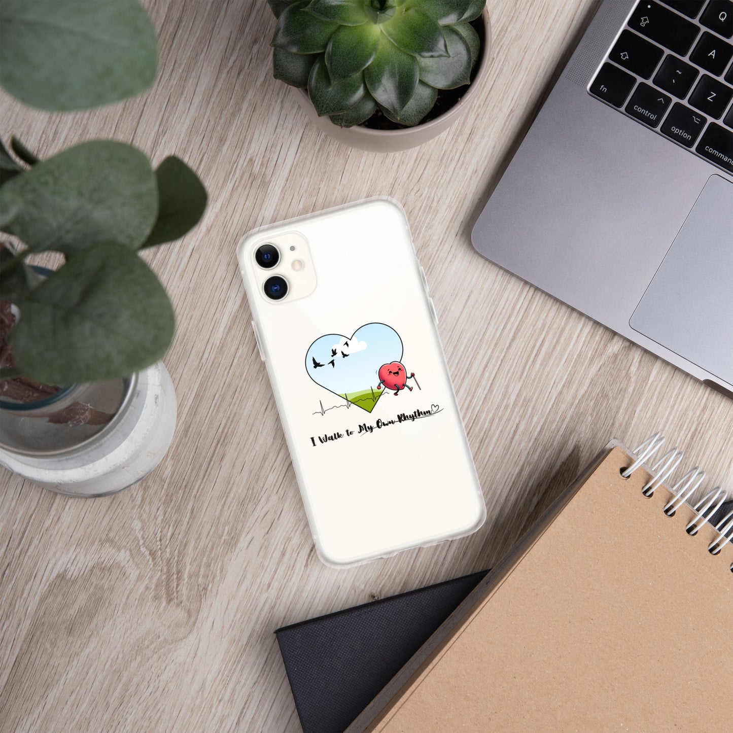 a phone case sitting on top of a desk next to a laptop