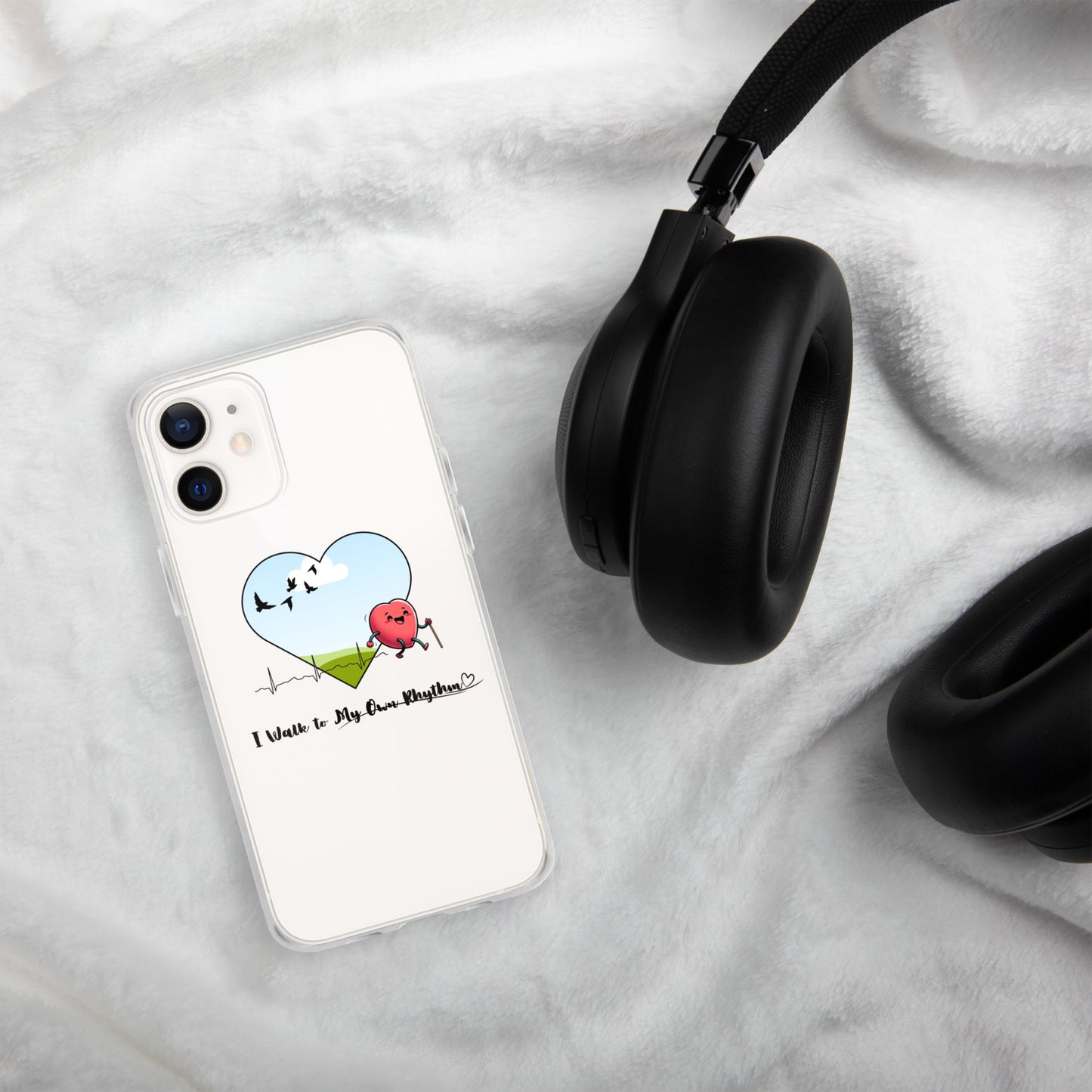 a phone case with a heart on it and headphones