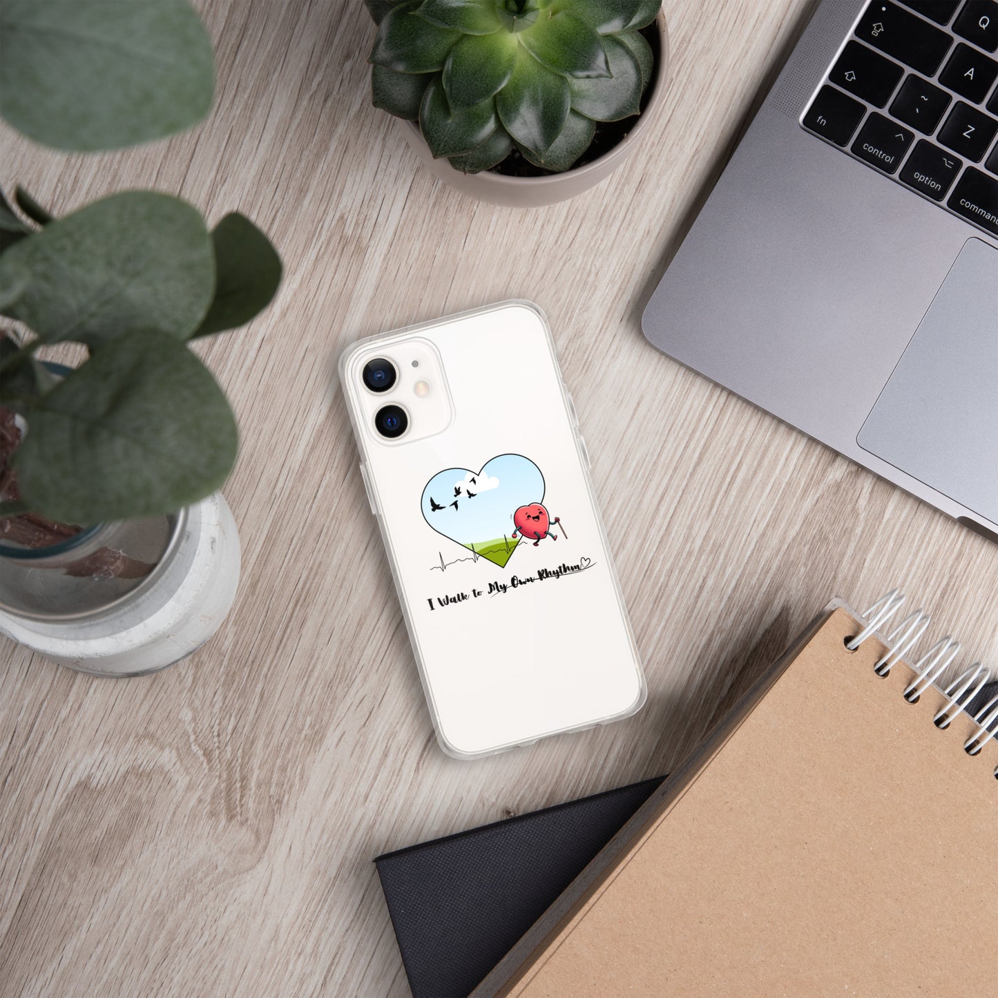 a phone case sitting on top of a desk next to a laptop