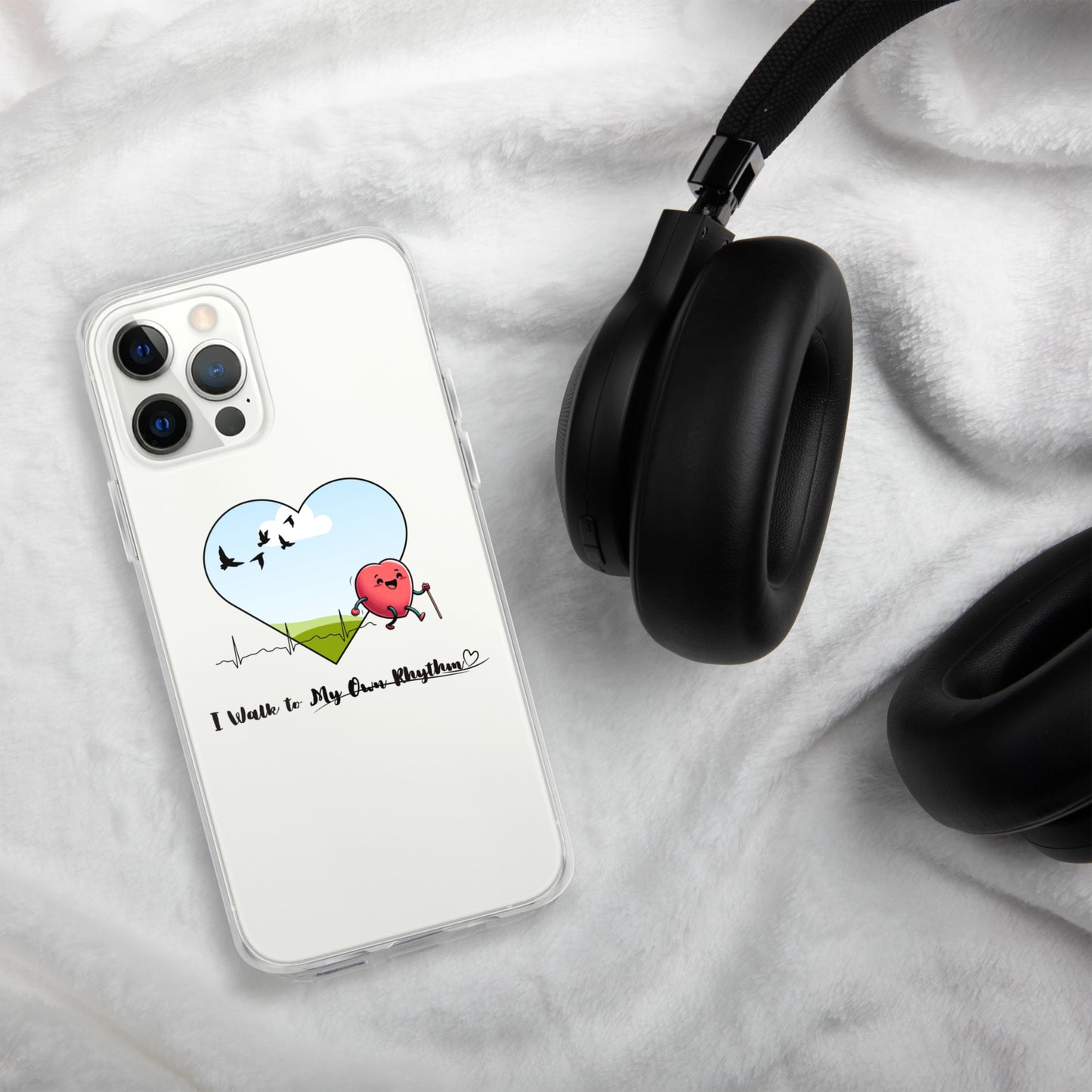 a phone case with a heart on it and headphones