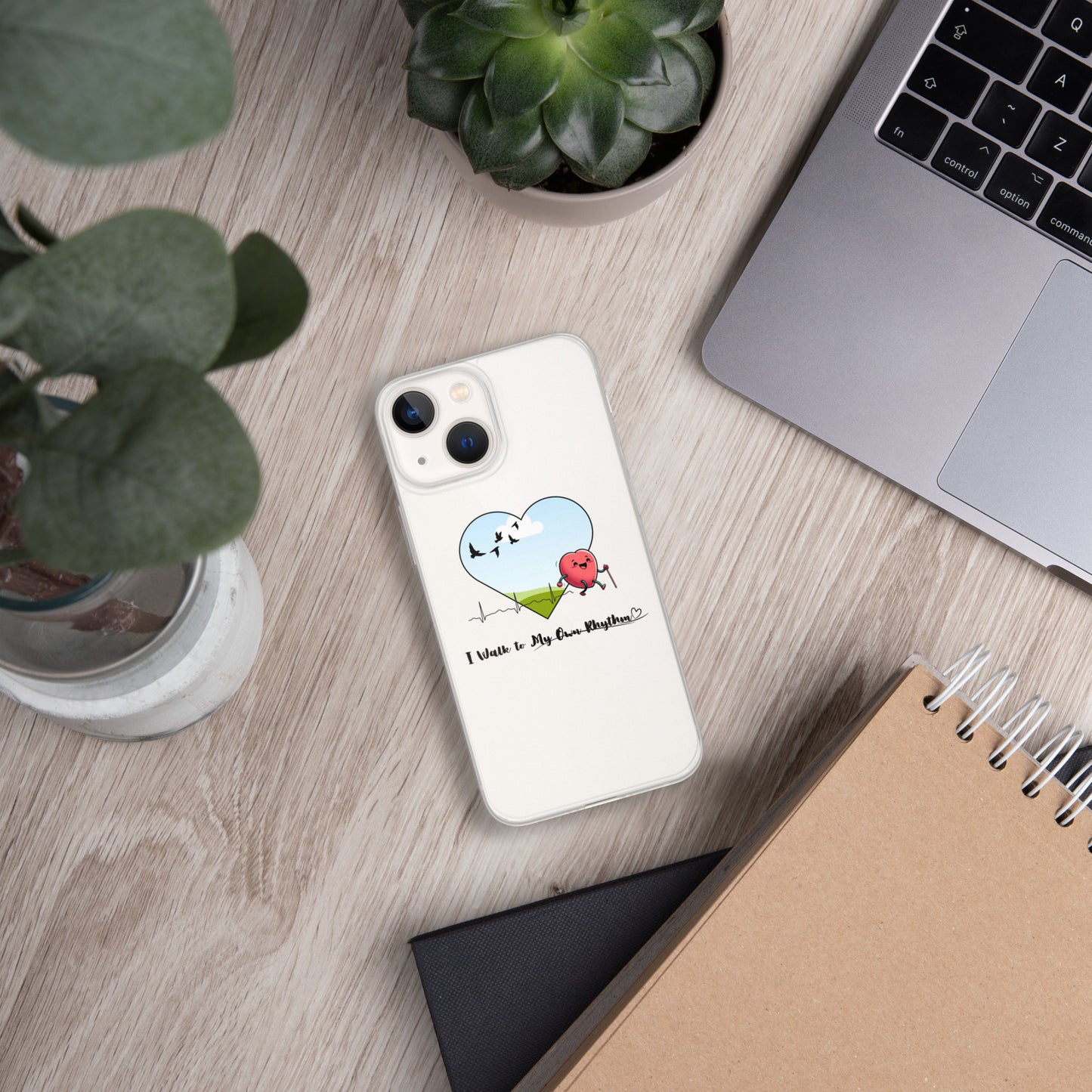 a phone case sitting on top of a desk next to a laptop